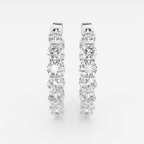 Oval hoop earrings with round stones in a white-metal finish, front view
