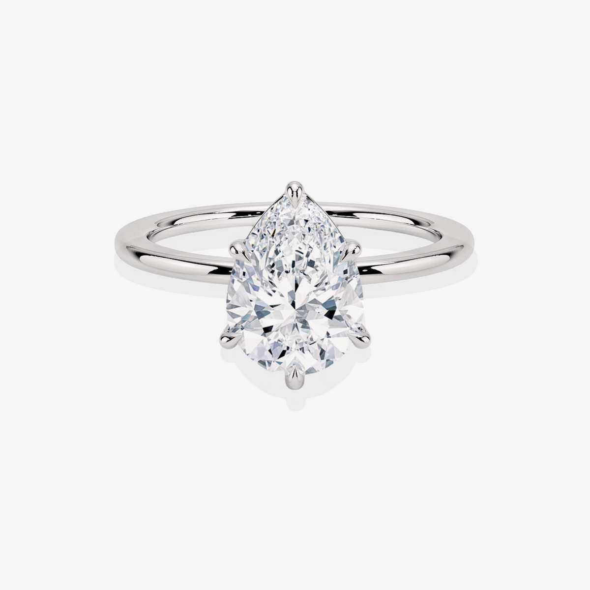 Elaria Sol Pear Cut Moissanite Diamond Petite Solitaire Engagement Sterling Silver Ring