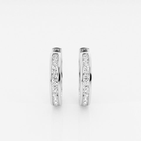 Channel-style round-stone hoop earrings in a white-metal finish, front view